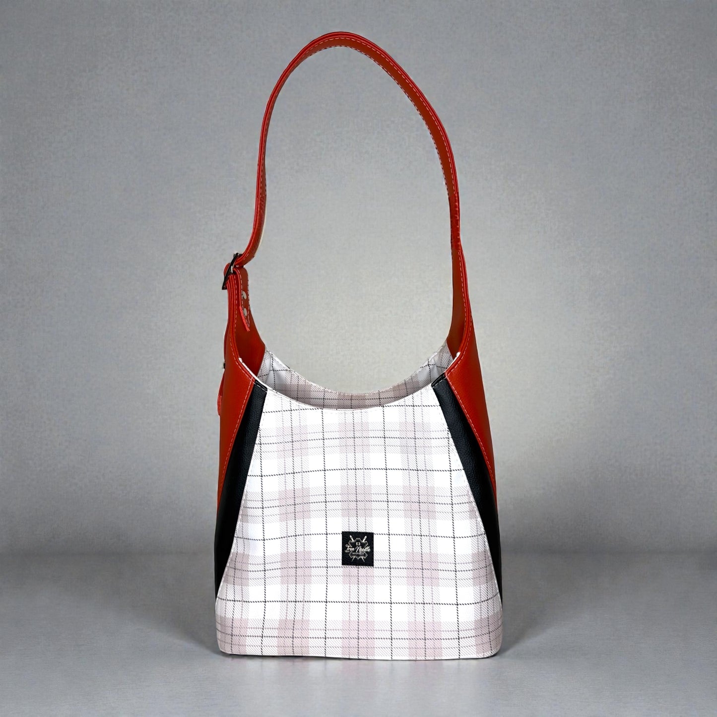 Orange and plaid adena shoulder bag