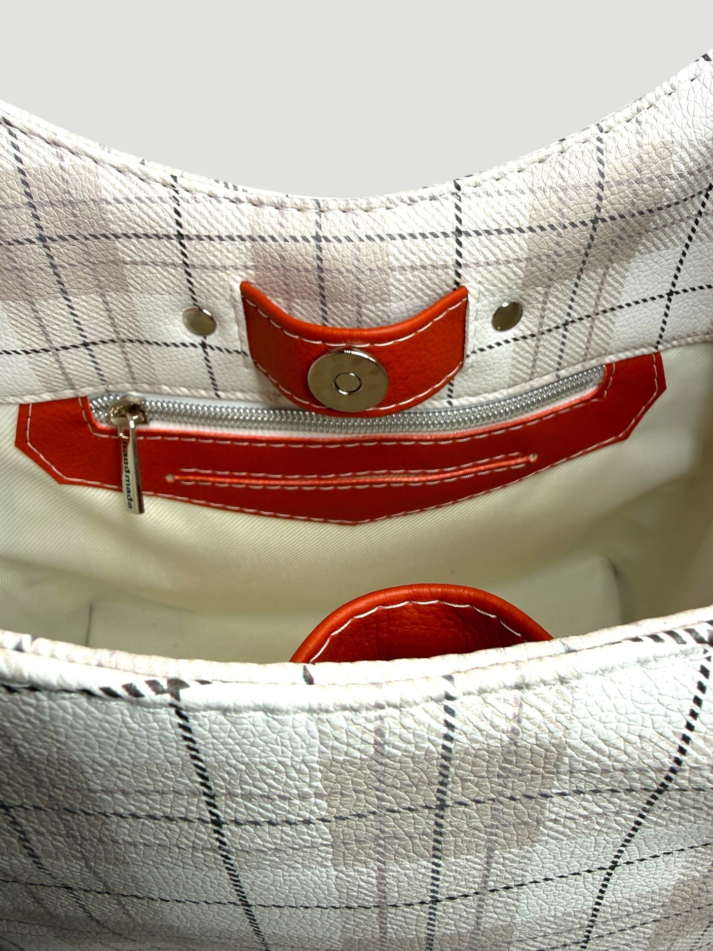 Orange and plaid adena shoulder bag