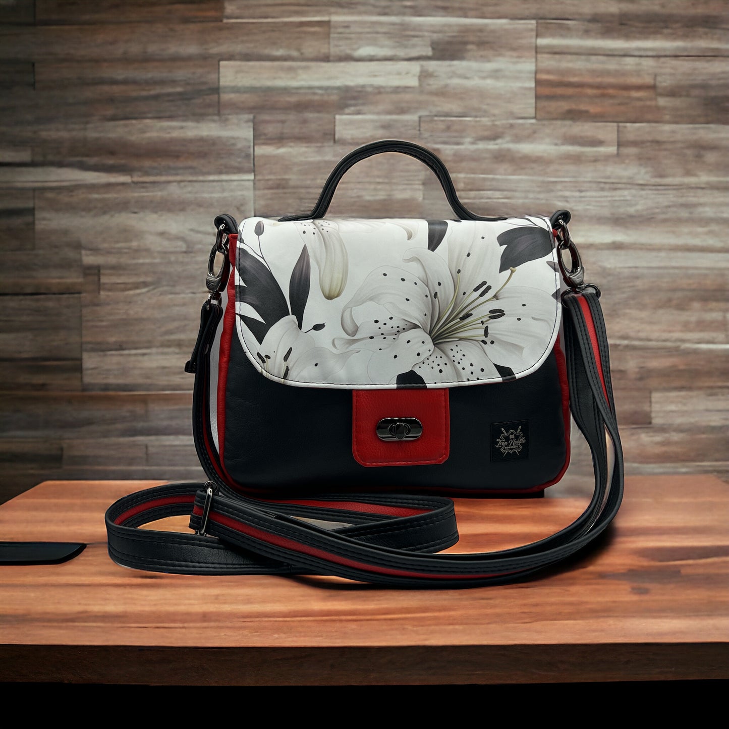 Red/black with white lilies Primula Satchel